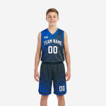 Royal blue youth basketball uniforms front view showing halftone dot gradient jersey and matching navy shorts with arced team name and number 00