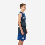 Front view of custom royal blue and navy youth basketball uniform set with V-neck jersey and matching shorts on youth boy model
