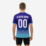 Chest detail of custom teal soccer training jersey showing player number and team name print in white
