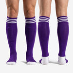 Full length view of custom purple soccer socks in Royal Purple with white striped cuff and white heel and toe panels
