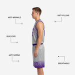 Back view of the silver-gray reversible basketball uniform showing purple player name and number above hex-patterned shoulders and matching shorts