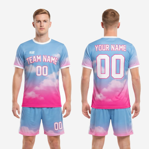 Full kit detail of sky blue and hot pink custom unique soccer uniforms showing gradient color transition from shoulder to hem