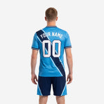 Close-up detail of sky blue sublimated soccer jersey with navy panel and white accent stripes