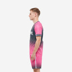 Soccer team kits pink and charcoal sublimated halftone design, back-side angle