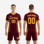 Full soccer uniform set in Maroon and Athletic Gold spike-stripe sublimation, adult male model wearing complete jersey and shorts kit