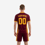Men's soccer team uniforms detail view showing Athletic Gold spike-stripe graphic across Maroon jersey front and V-neck trim