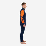 Left side view of custom sublimated soccer training tracksuit in navy blue with athletic orange splash sleeve pattern and tapered pants