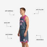Back view of the gray and pink custom reversible basketball uniform showing back player number placement and brush-splash shoulder graphic