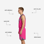 Shorts detail of the reversible gray and pink basketball uniform showing the diagonal brush-splash sublimated panel and hem trim