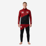 Men's custom red and black soccer tracksuit with diagonal colorblock panel and white stripe trim, front view