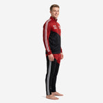 Custom red and black soccer tracksuit stand collar full zip jacket and tapered pants, left side view