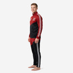 Red and black soccer tracksuit with white double-stripe sleeve and pant leg trim, right side view