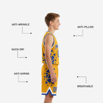Back view of custom gold youth basketball jersey with player name and number on royal blue starburst panel background and matching shorts