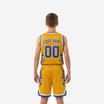 Opposite side view of gold sublimated youth basketball uniform set highlighting royal blue geometric starburst design on jersey and shorts side panels