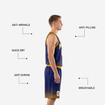 Close detail of sublimated starburst ray pattern and halftone dot fade on navy and gold basketball jersey