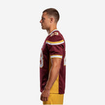 Left side view of custom maroon football jersey with gold-and-white stripe cuff trim and gold mesh side panel, worn by adult male player