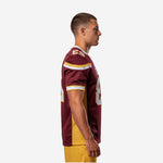 Side view of maroon and gold American football jersey showing gold mesh side panel insert, stripe shoulder band, and sleeve TV number on adult male model