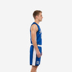 Men's sublimated basketball jersey and shorts set in royal blue with white side panels and arced team name across the chest, front view