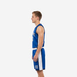Side view of royal blue sublimated basketball jersey and shorts showing white side panel running from armhole to hem on jersey and shorts leg