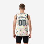 Opposite side view of cream custom basketball jersey with all-over multicolor triangle and geometric sublimation pattern and structured V-neck trim
