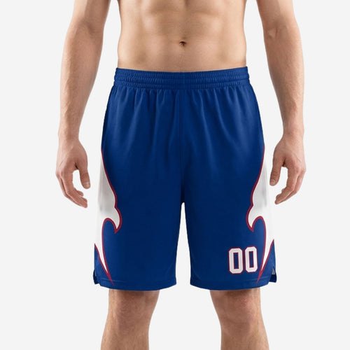Custom sublimated basketball shorts in royal blue with large white eagle wing side panel and crimson trim, player number 00 on front thigh, front view on male model