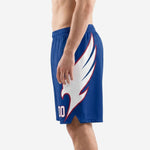 Side view of custom sublimated basketball shorts showing full white eagle wing graphic with crimson feather detail sweeping from hip to hem split on royal blue shorts