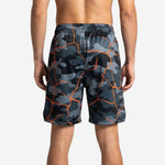 Back view of custom camo basketball shorts with sublimated orange crack-line design and wide elastic ribbed waistband