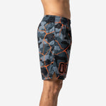 Side view of custom sublimated basketball shorts showing full camo pattern, orange crack-line print, and elastic waistband with drawcord