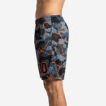 Right side view of grey and black camo sublimated basketball shorts with orange accent lines running to the hem and side split detail