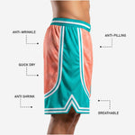 Back view of custom sublimated basketball shorts in teal and coral showing full-dye sublimation panel layout