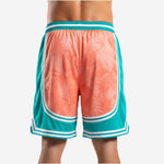 Opposite side view of custom teal and coral basketball shorts showing retro arc side split and white stripe trim detail