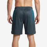 Back view of custom sublimated basketball shorts in teal to charcoal hex gradient with back player number placement visible