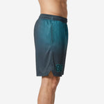 Side view of custom sublimated basketball shorts showing teal hex fade to charcoal grey with side split at hem and elastic drawcord waistband