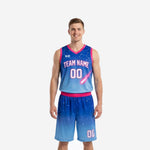 Sublimated basketball uniforms in royal to sky blue gradient with pink trim constellation print jersey and matching shorts full set front view