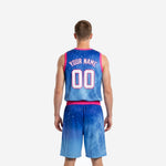 Opposite side view of sublimated basketball jersey and shorts set in royal blue to sky blue gradient with pink armhole binding and waistband