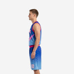 Side view of custom blue and pink sublimated basketball uniform showing V-neck jersey with shooting comet graphic and gradient shorts