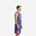 Side view of blue and pink sublimated basketball uniform set showing gradient fade from steel blue at shoulder to magenta at hem and shorts leg