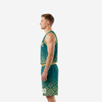 Side view of teal and gold sublimated basketball uniform showing continuous Aztec diamond pattern across jersey side panel and shorts leg