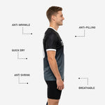 Detail view of sublimated black charcoal mens soccer training jersey showing breathable polyester knit and V-neck collar construction