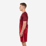 Sublimated crimson and white soccer kit showing jersey and shorts side profile, right view