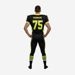 Right-side view of black and neon yellow matching team football uniform showing V-neck collar, shoulder panels, and pant stripe alignment