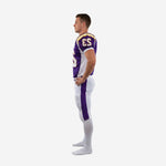 Sublimated purple and white football uniform left side view showing shoulder panel gold stripe, set-in sleeve, and full-length white game pants with purple pant stripe
