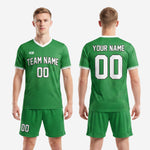 Close side view of sublimated green soccer kit showing white trim detail on sleeves and shorts stripe