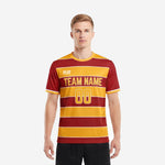 Sublimated mens soccer shirt in maroon and athletic gold horizontal stripe with crew neck, front view on male model