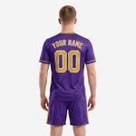 Close detail of sublimated purple soccer jersey with Vegas Gold v-neck trim and marble swirl pattern