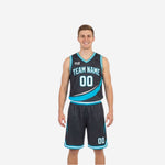 Sublimated reversible basketball uniforms in charcoal and teal with sweeping diagonal panel team name and number 00 on front