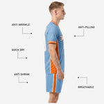 Back view of sky blue custom futbol uniform showing player name and number placement with orange accents