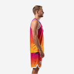 Left side view of sunset gradient basketball uniforms showing jersey and shorts profile