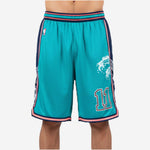 Custom teal basketball shorts with navy side panels, pink double-stripe trim, and front player number 11 in navy and pink outline, front view