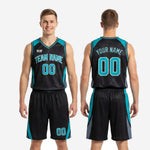 Detail view of teal basketball uniform shorts showing curved teal side panel, grey accent, and sublimated number on lower left leg